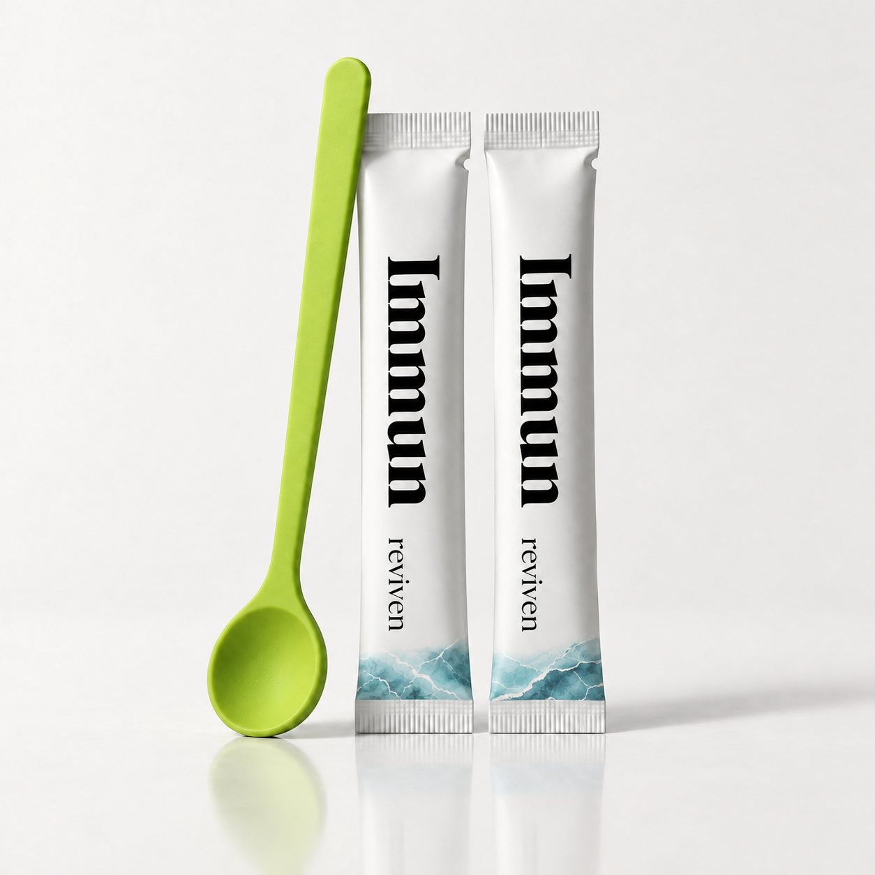Limettengrüner Rührlöffel neben zwei reviven Sticks